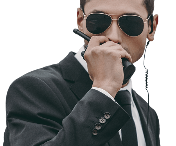 handsome-bodyguard-in-sunglasses-talking-by-portab-2022-12-16-16-34-29-utc-2